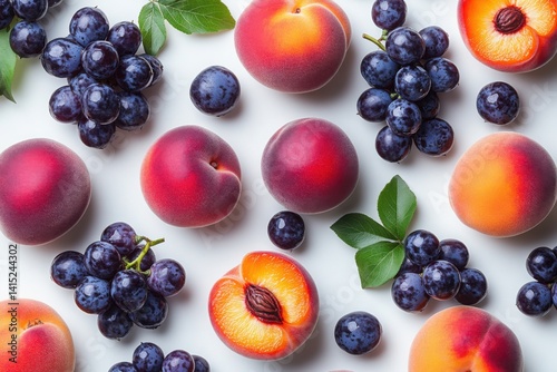 Freshly picked fruit assortment including peaches grapes and plums arranged together