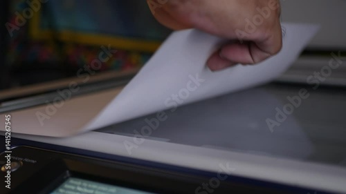 Close up office man using scanner panel the Office professional multi-function printer scanner for scanning document and printing. a Copy machines