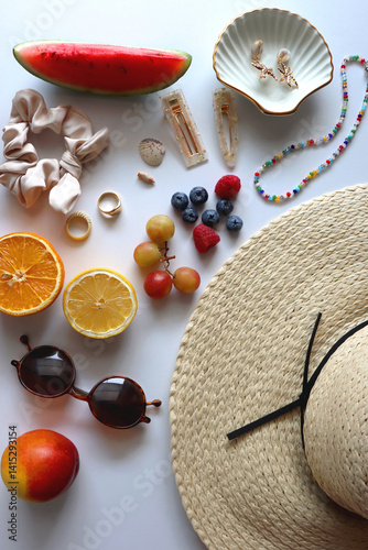 Obraz na płótnie Straw hat, sunglasses, seasonal fruit, seashells and colorful accessories on white backgrounds. Cute summer essentials. Flat lay. w salonie