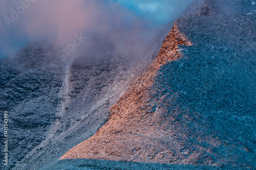 Stunning light illuminating the majestic mountain landscape in Rondane, Norway during twilight photo