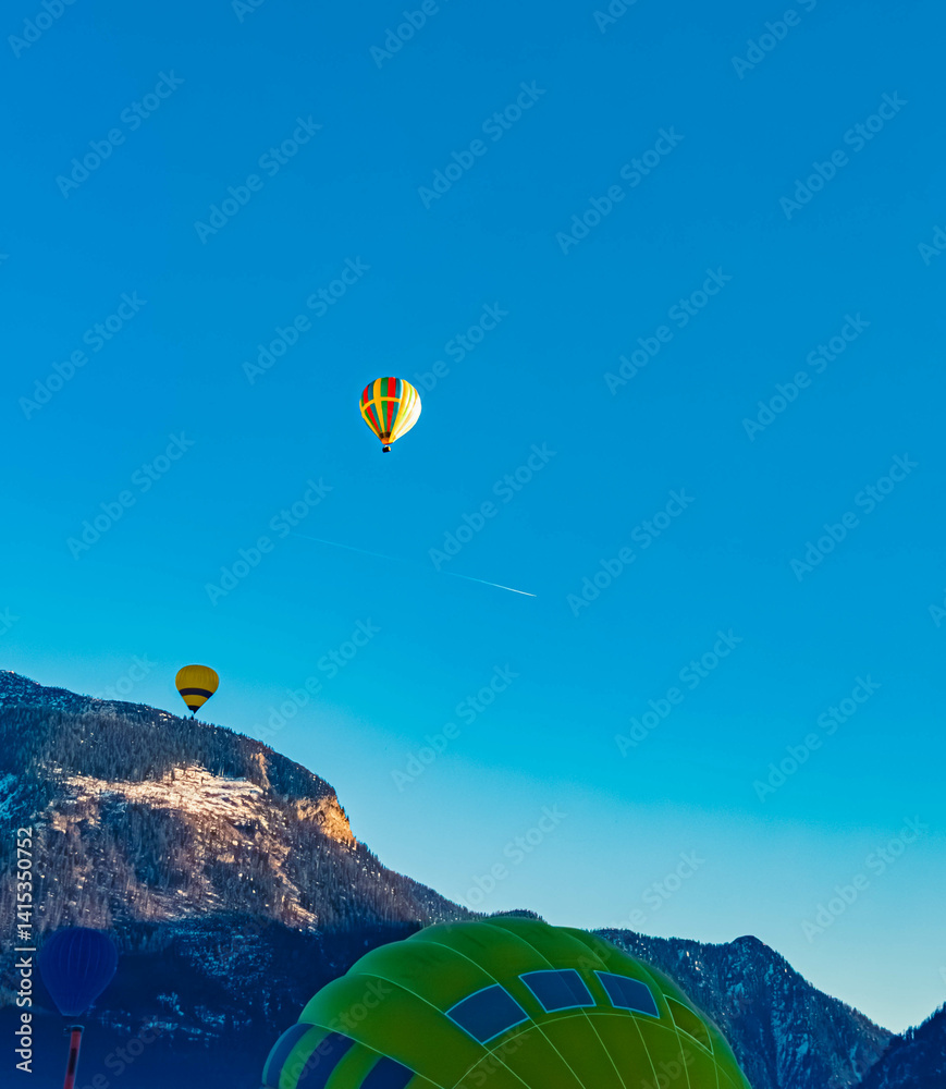 Alpine winter view with hot air balloons at Gosau, Abtenau, Salzkammergut, Salzburg, Austria