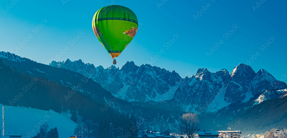 Alpine winter view with hot air balloons at Gosau, Abtenau, Salzkammergut, Salzburg, Austria