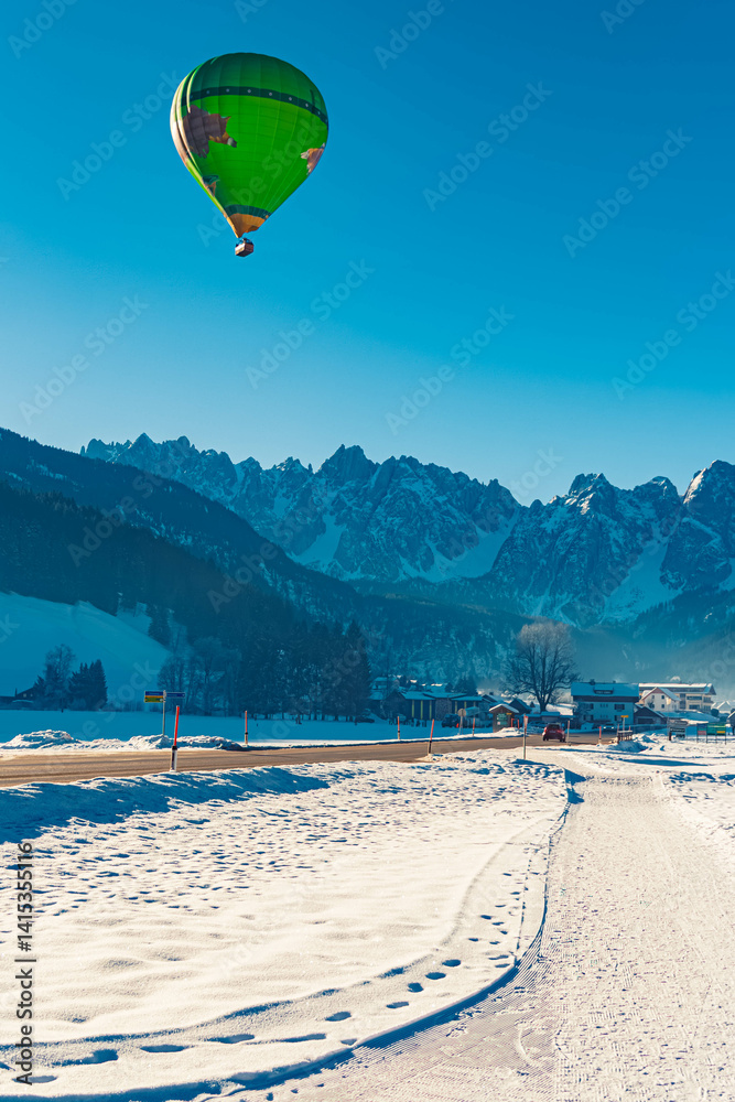 Alpine winter view with hot air balloons at Gosau, Abtenau, Salzkammergut, Salzburg, Austria
