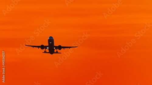 Summer sunset or sundowner view with a jet airplane at Munich airport, MUC, Freising, Bavaria, Germany