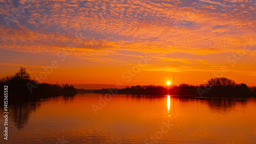 Sunset with reflections near Plattling, Isar, Bavaria, Germany