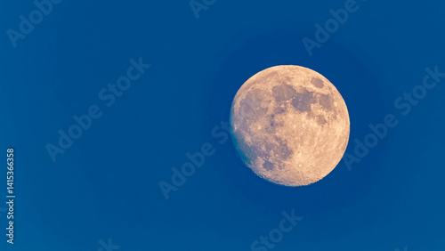Obraz na płótnie Detailed megazoom (600mm) winter view of the moon with craters during daytime with blue sky w salonie