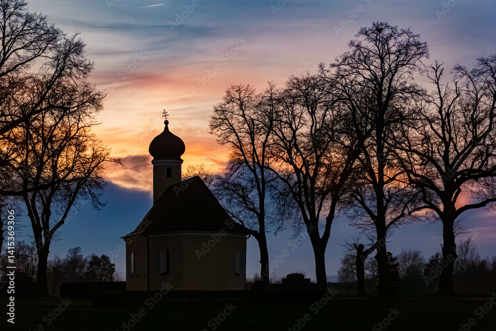 Sunset with a church silhouette near Wallersdorf, Dingolfing-Landau, Bavaria, Germany