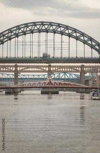 Obraz na płótnie Stunning view of the Newcastle upon tyne with Tyne bridge, Swing bridge and The High level bridge spanning the River Tyne connecting Newcastle upon tyne and Gateshead in North East England. sunset. w salonie