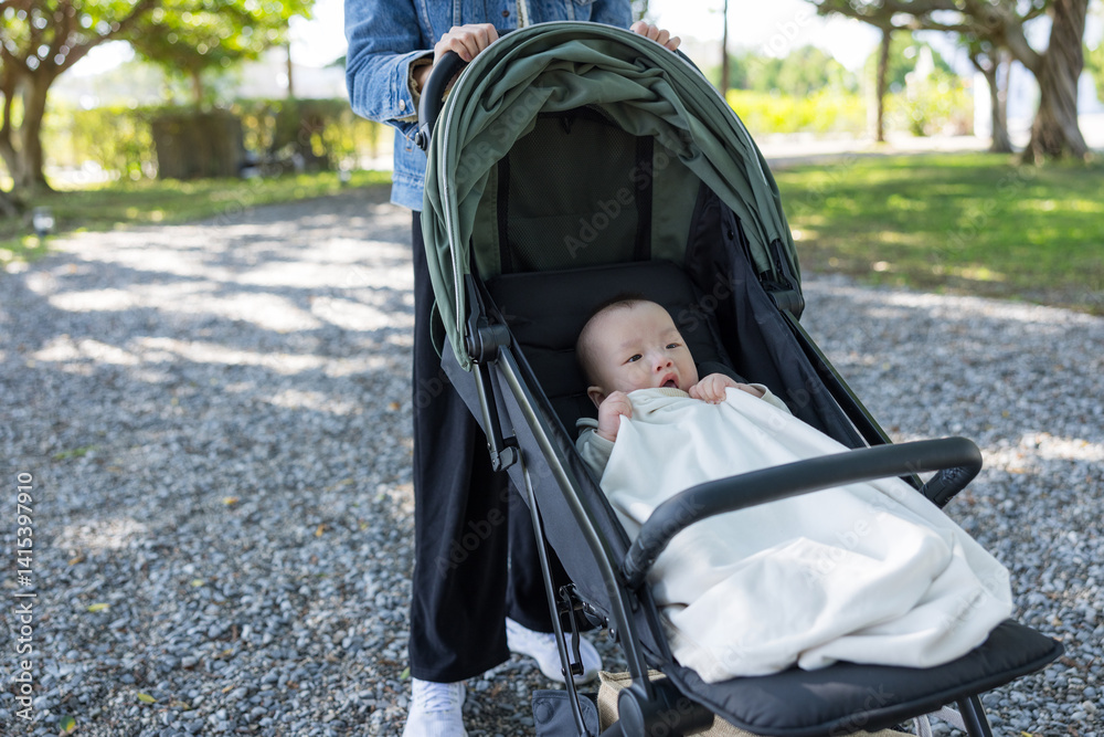 Loving mother takes baby for outdoor walk