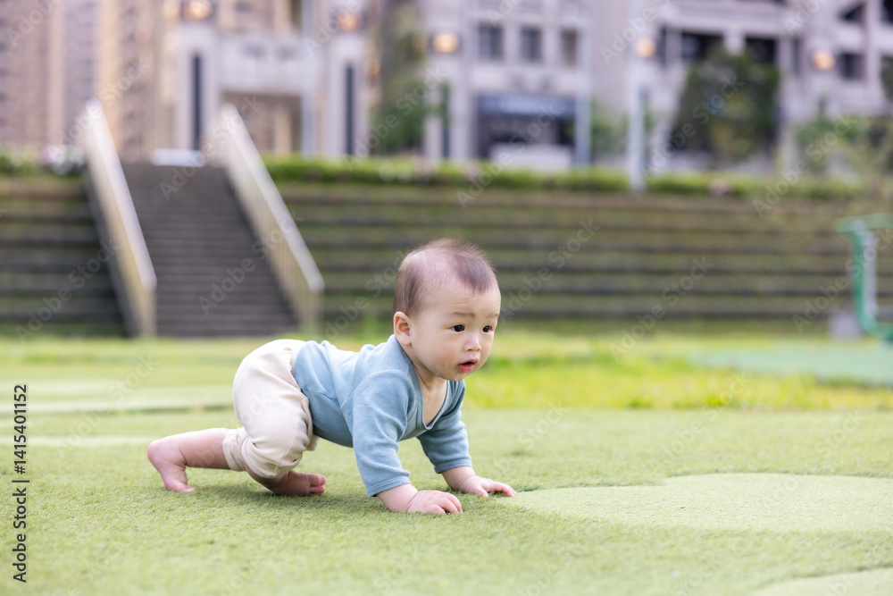 Little baby explore nature on fresh grass