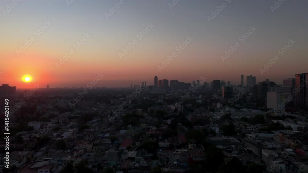 Drone view of a city skyline with modern high-rise buildings in the background at Sunrise Drone view of a city skyline with modern high-rise buildings in the background at Sunrise