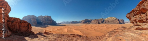 Spectacular panoramic view of Wadi Rum desert, showcasing sand dunes and rock formations under a clear sky.