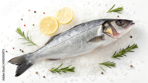 Obraz na płótnie A whole fish is displayed on a bed of ice, garnished with lemon slices and fresh herbs. This setup is ideal for showcasing seafood before cooking w salonie