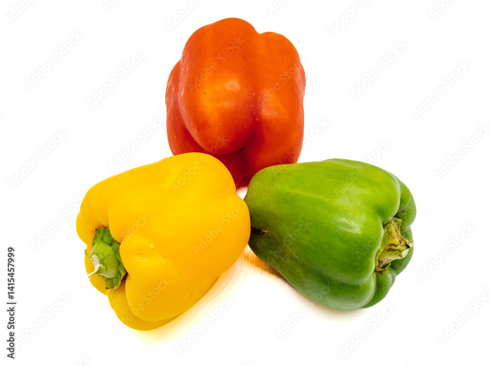 three colored bell peppers isolated on white background