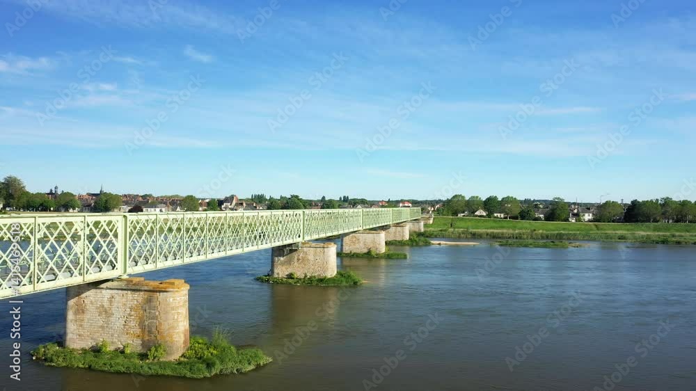 The Loire River overflowing under the arches of Sully in Europe, in France, in the Centre region, in Loiret, in summer, on a sunny day. The Loire River overflowing under the arches of Sully in Europe, in France, in the Centre region, in Loiret, in summer, on a sunny day.