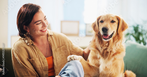 Obraz na płótnie Dog, woman and play with paw on sofa in home, relax and care with bonding, happy and trust in living room. Person, pet and golden retriever with touch, training and loyalty with love at apartment w salonie