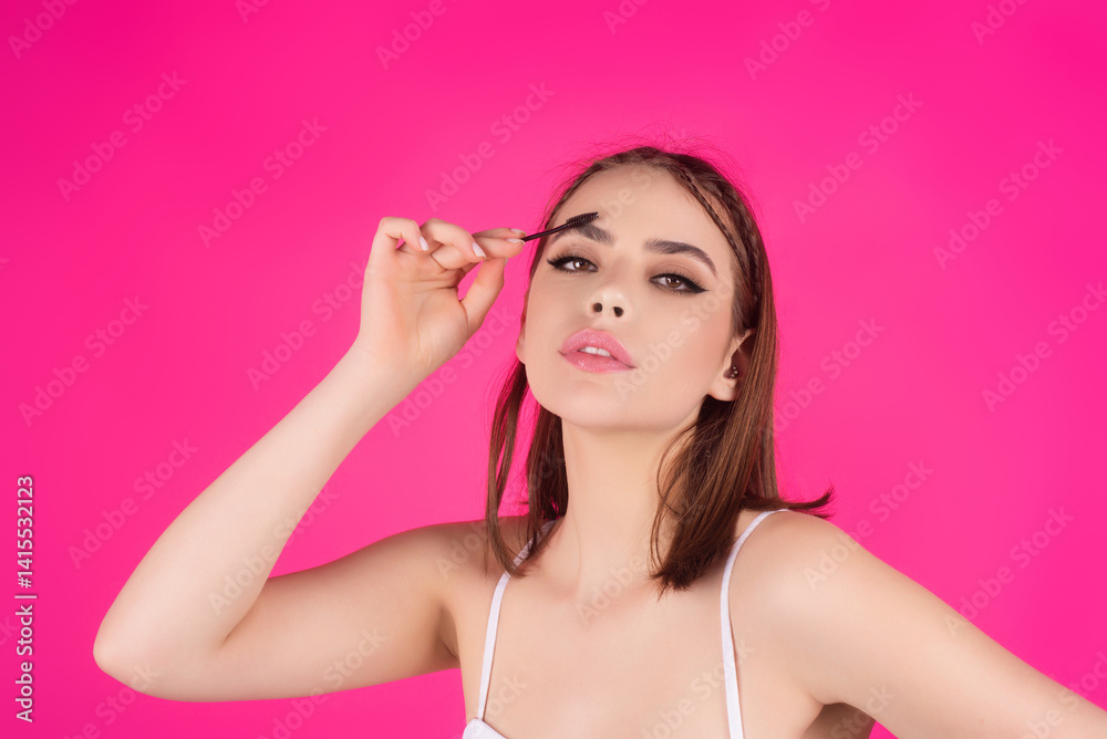 Eyebrow makeup. Beauty model shaping brows with brow pencil closeup. Womans eyebrows with eyebrow brush. Natural make up. Modeling brows. Comb eyebrows. Eyebrow makeup. Beauty model shaping brows with brow pencil closeup. Womans eyebrows with eyebrow brush. Natural make up. Modeling brows. Comb eyebrows.