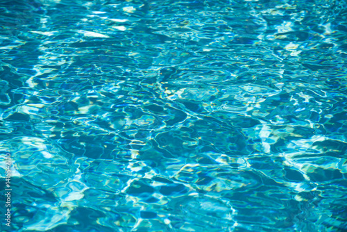 Wallpaper Mural Water background. Blue water, ripples and highlights. Texture of water surface and tiled bottom. Torontodigital.ca