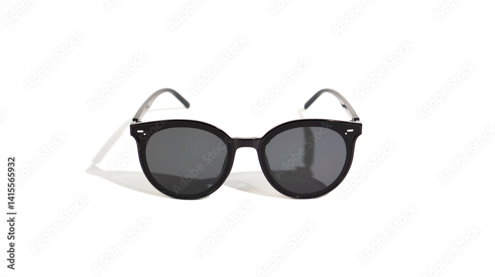 Elegant black framed sunglasses with subtle shadow on a white background Elegant black framed sunglasses with subtle shadow on a white background
