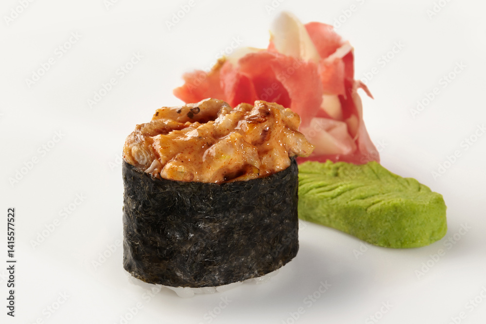 Spicy gunkan maki sushi with ginger and wasabi on white background