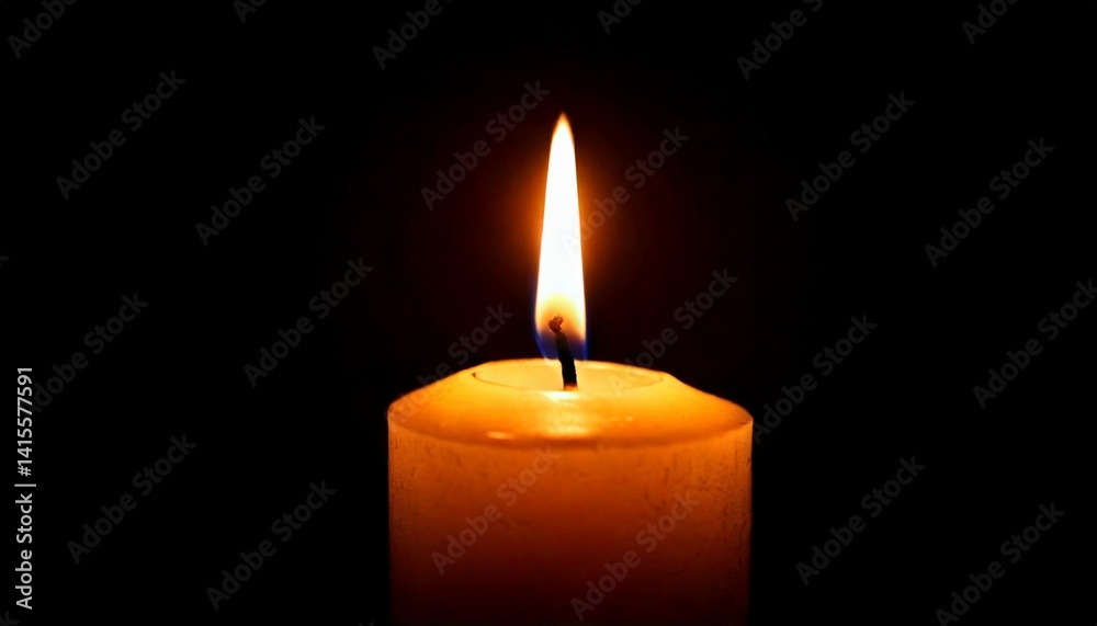 One candle burning slowly isolated on pitch black background One candle burning slowly isolated on pitch black background