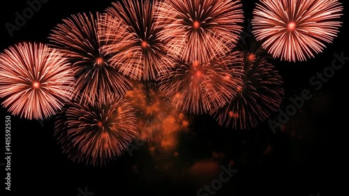 Fireworks celebration 4k video clip.Amazing fireworks footage 4k resolution,background golden shining fireworks with bokeh lights in the night sky. glowing fireworks show. New year's eve fireworks