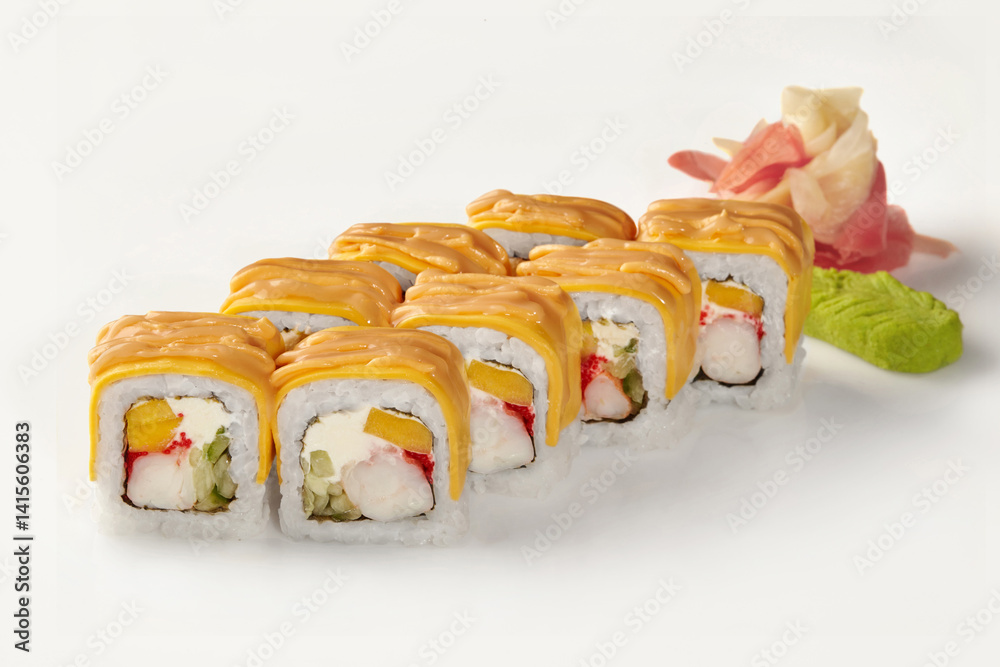 Delicious sushi rolls covered with cheese sauce and mango filling on white background