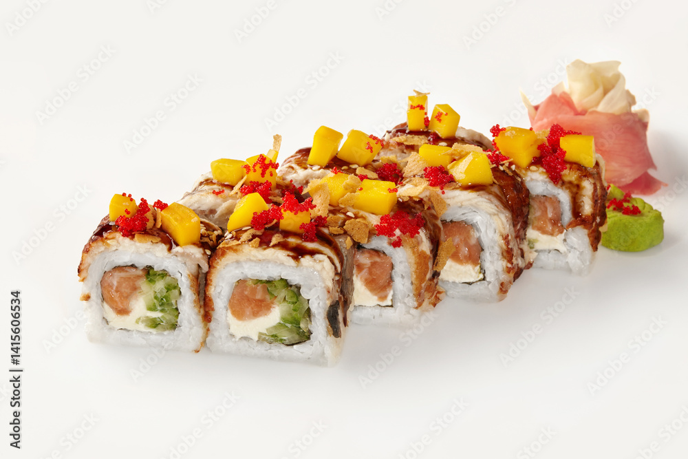 Delicious sushi rolls with mango, salmon, and red tobiko on white background
