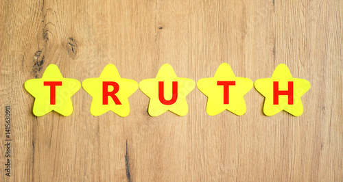 Wallpaper Mural Truth symbol. Concept word Truth on beautiful yellow paper stars. Beautiful wooden table wooden background. Business lifestyle truth concept. Copy space. Torontodigital.ca
