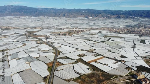 Aerial view of Mar de Plastico, Sea of ​​Plastic, in Almería. A vast expanse of land covered with plastic greenhouses for the production of fruits and vegetables, larger than Almería itself