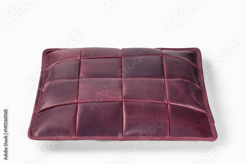 Obraz na płótnie Burgundy leather cushion floating on white background: modern home decor w salonie