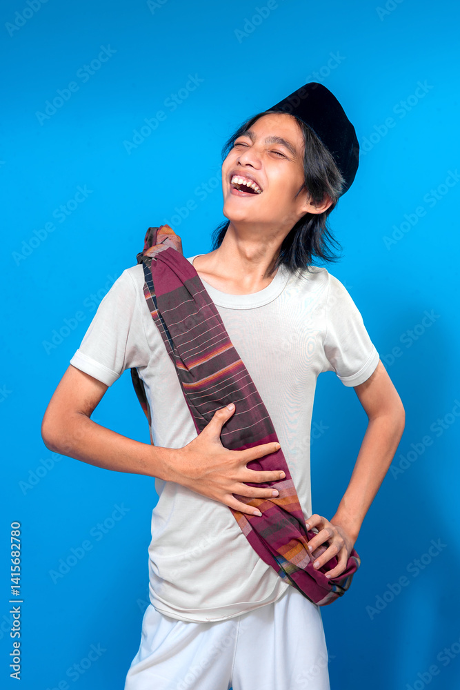 An Indonesian man wearing a traditional peci and misaligned sarong bursts into joyful laughter, expressing pure happiness with an open mouth and bright facial expression. An Indonesian man wearing a traditional peci and misaligned sarong bursts into joyful laughter, expressing pure happiness with an open mouth and bright facial expression.