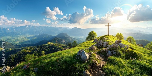 Cross on a mountaintop surrounded by God's light and a rainbow, symbolizing divine presence and the glory of Christ's resurrection.