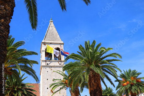 Obraz na płótnie Historical church and monastery of Saint Dominic, in Trogir, Croatia. Flags of Croatia and Vatican City on the tower. w salonie