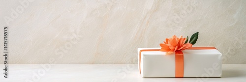 Obraz na płótnie a white box with a orange ribbon w salonie