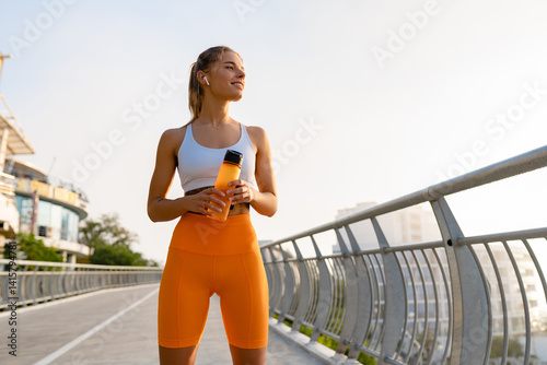 pretty young smiling woman doing sports in the morning in stylish sport outfit sportswear, skinny strong body, healthy fit lifestyle