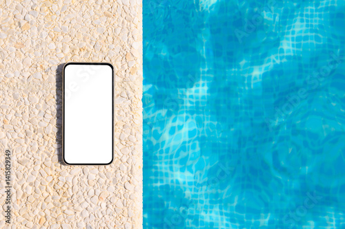 Phone by the pool with blue water. Blank white smartphone display. Vacation ad template