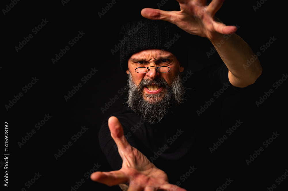 Dramatic portrait of an energetic man with a beard and glasses reaching out to the camera, trying to take it with his hands. Subtle lighting, emotional expression, dark background, mysterious concept