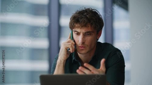 Worried boss speaking cellphone feeling tension at corporate workplace closeup.