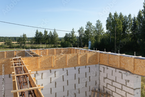 Wallpaper Mural Construction Progress: Wooden Formwork and Rebar for Concrete Foundation with Rural Landscape Background Torontodigital.ca