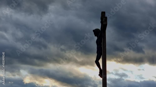 Jesus Christ crucifixion on Golgotha hill, dramatic dark and stormy clouds, 4K time lapse