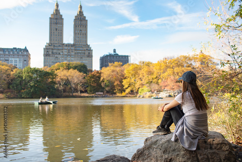 Photography young woman sitting in Central Park New York