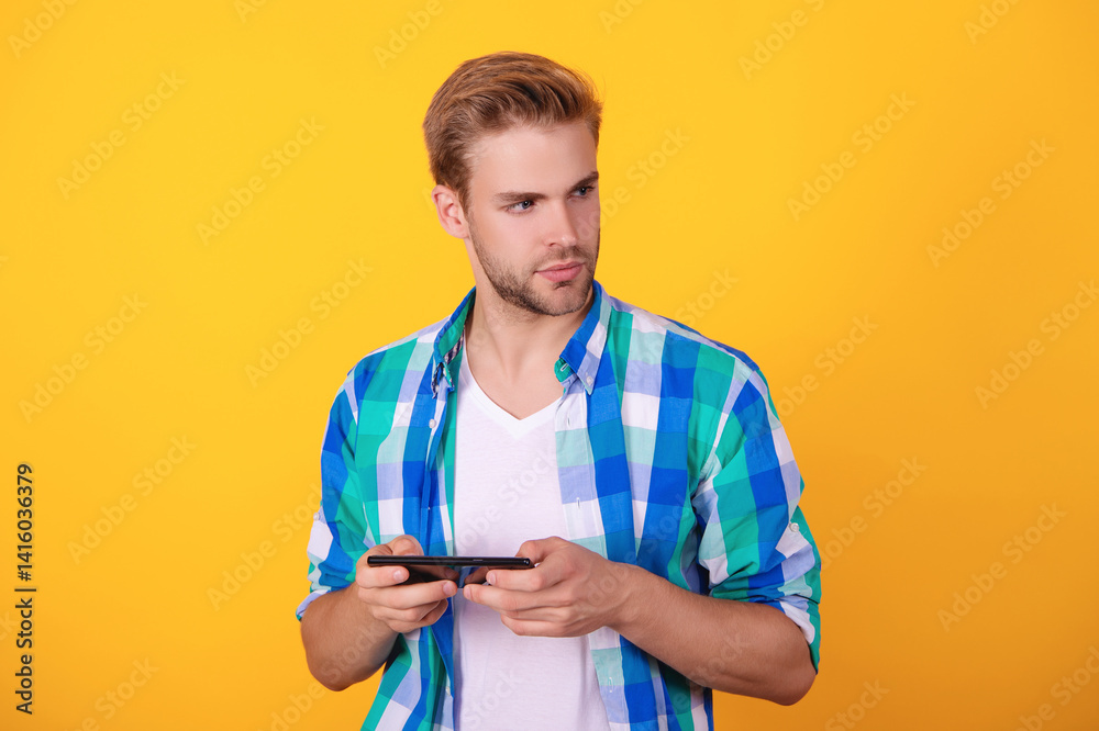 Video game online. Video game and gaming. Young millennial guy playing game online. Video gaming on phone. Gamer youth. Man gamer play video game online with smartphone Video game online. Video game and gaming. Young millennial guy playing game online. Video gaming on phone. Gamer youth. Man gamer play video game online with smartphone