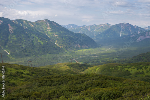 Summer mountain landscape. View from the mountains to the valley. Travel, tourism and hiking on the Kamchatka Peninsula. Beautiful nature of Siberia and the Russian Far East. Kamchatka Krai, Russia. photo