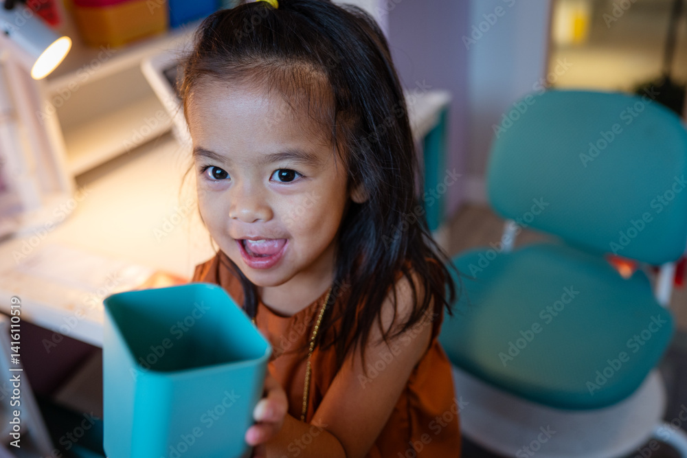 Adorable kids girl enjoy toy in kid room cozy house