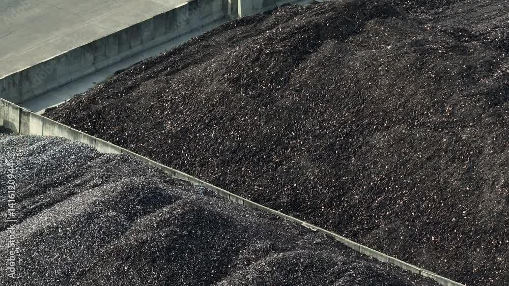 A drone view of glass waste being sorted in a recycling facility, demonstrating the efficient recovery of glass for sustainable repurposing.