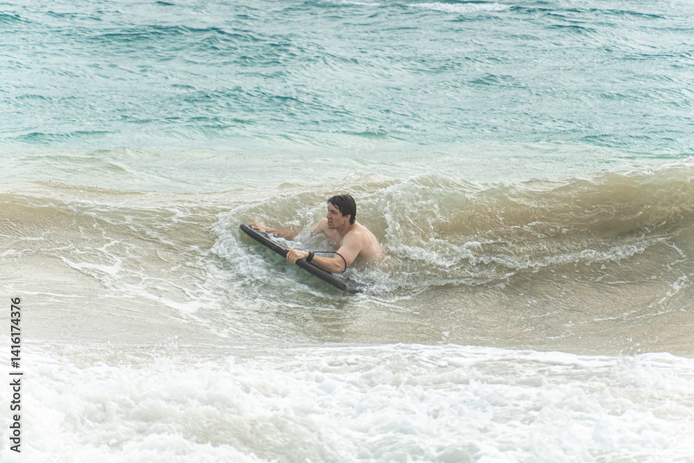 boogie boarding at Poipu beach boogie boarding at Poipu beach