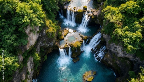 Aerial View of Scenic Waterfall Surrounded by Lush Green Forest