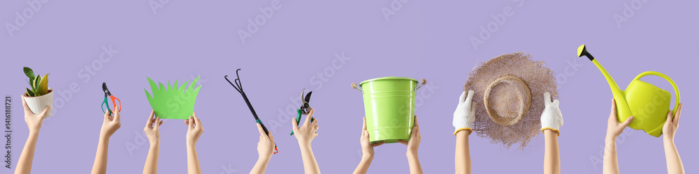Female hands with gardening tools, plant and paper grass on lilac background