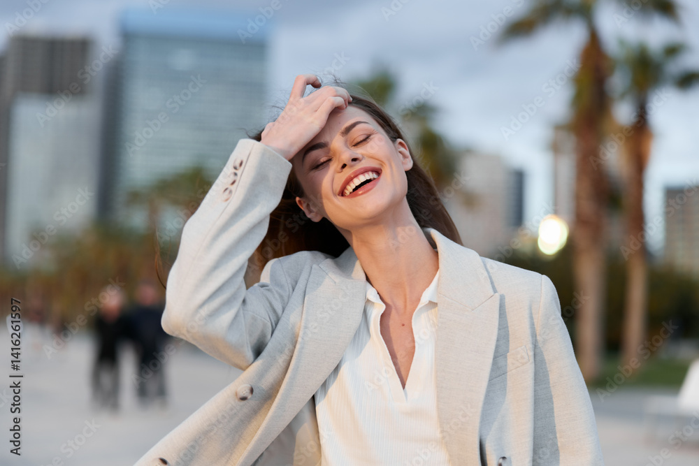 cheerful woman in business casual outfit enjoying urban outdoor setting with joyful smile and relaxed pose in modern city environment